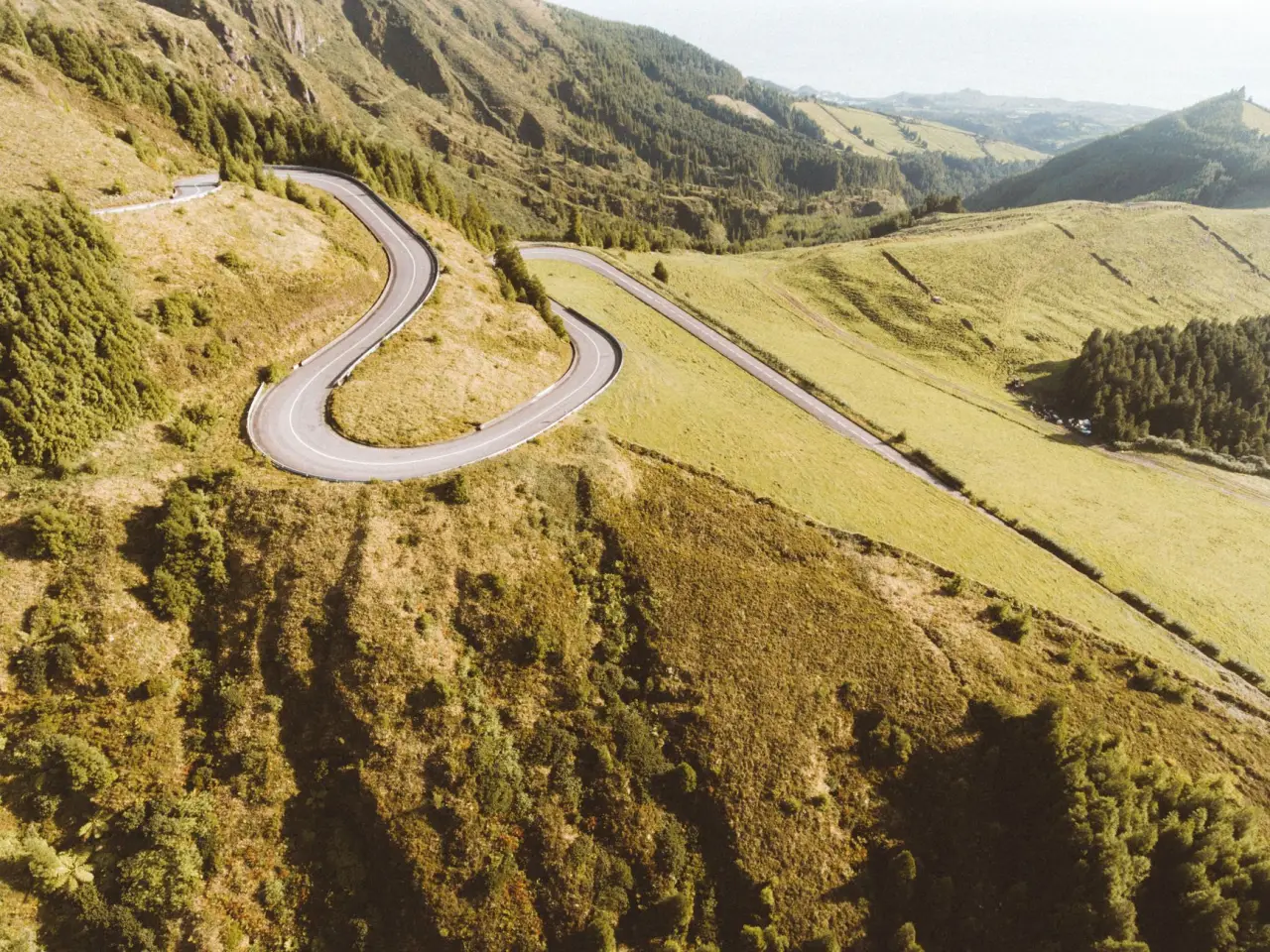 A winding mountain road seen from the air
